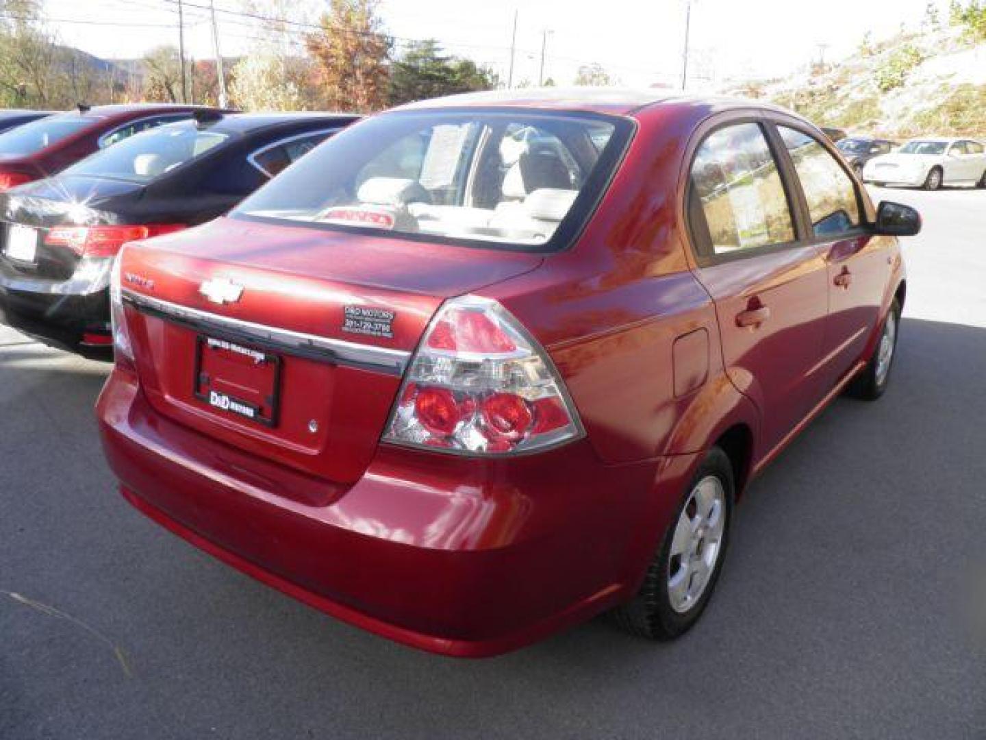 2007 Red /Neutral Cloth Seats Chevrolet Aveo LS 4-Door (KL1TD56627B) with an 1.6L I4 engine, AT transmission, located at 15520 McMullen Hwy SW, Belair, MD, 21502, (301) 729-3700, 39.581375, -78.846451 - Photo#4