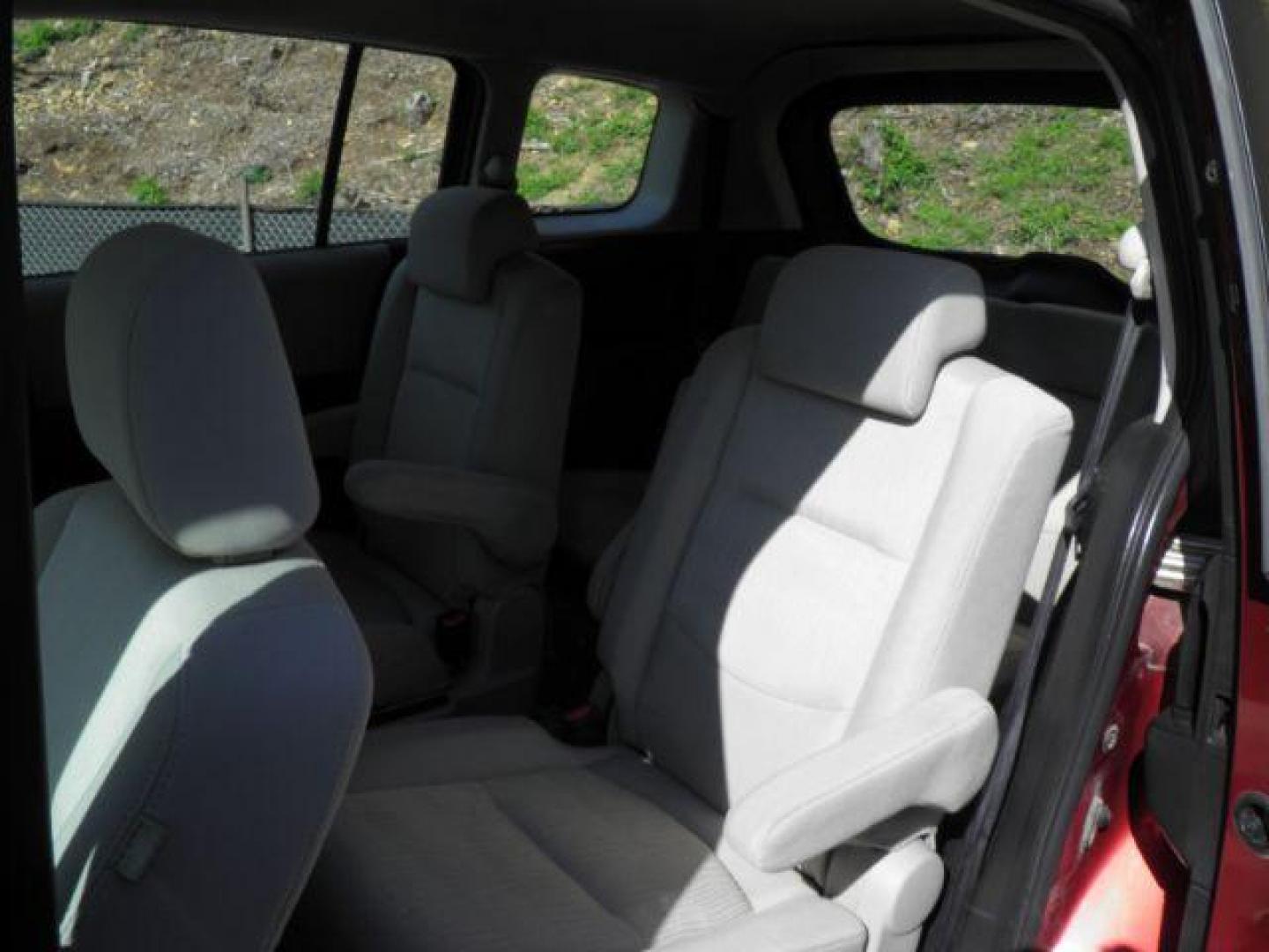 2010 RED Mazda MAZDA5 Touring (JM1CR2WL8A0) with an 2.3l L4 engine, 5SP transmission, located at 19521 New George's Creek Rd SW, Barton, MD, 21521, (301) 463-2404, 39.524323, -79.017906 - Photo#3