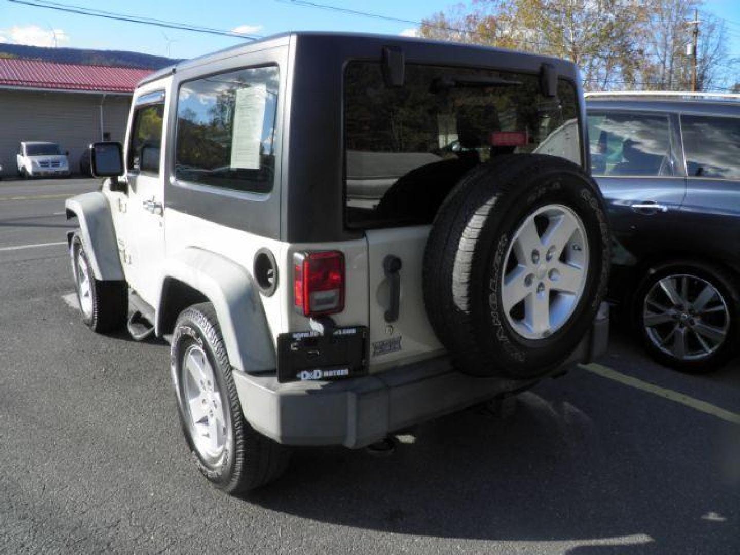 2011 Tan Jeep Wrangler Sport (1J4AA2D10BL) with an 3.8L V6 engine, AT transmission, located at 15520 McMullen Hwy SW, Belair, MD, 21502, (301) 729-3700, 39.581375, -78.846451 - Photo#5