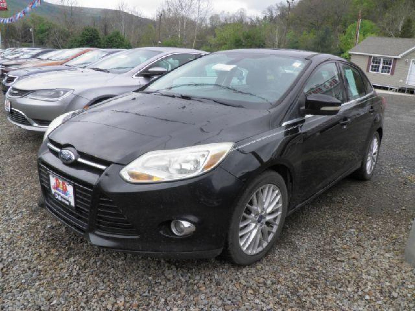 2012 Black Ford Focus SEL Sedan (1FAHP3H2XCL) with an 2.0L I4 engine, AT transmission, located at 19521 New George's Creek Rd SW, Barton, MD, 21521, (301) 463-2404, 39.524323, -79.017906 - Photo#0