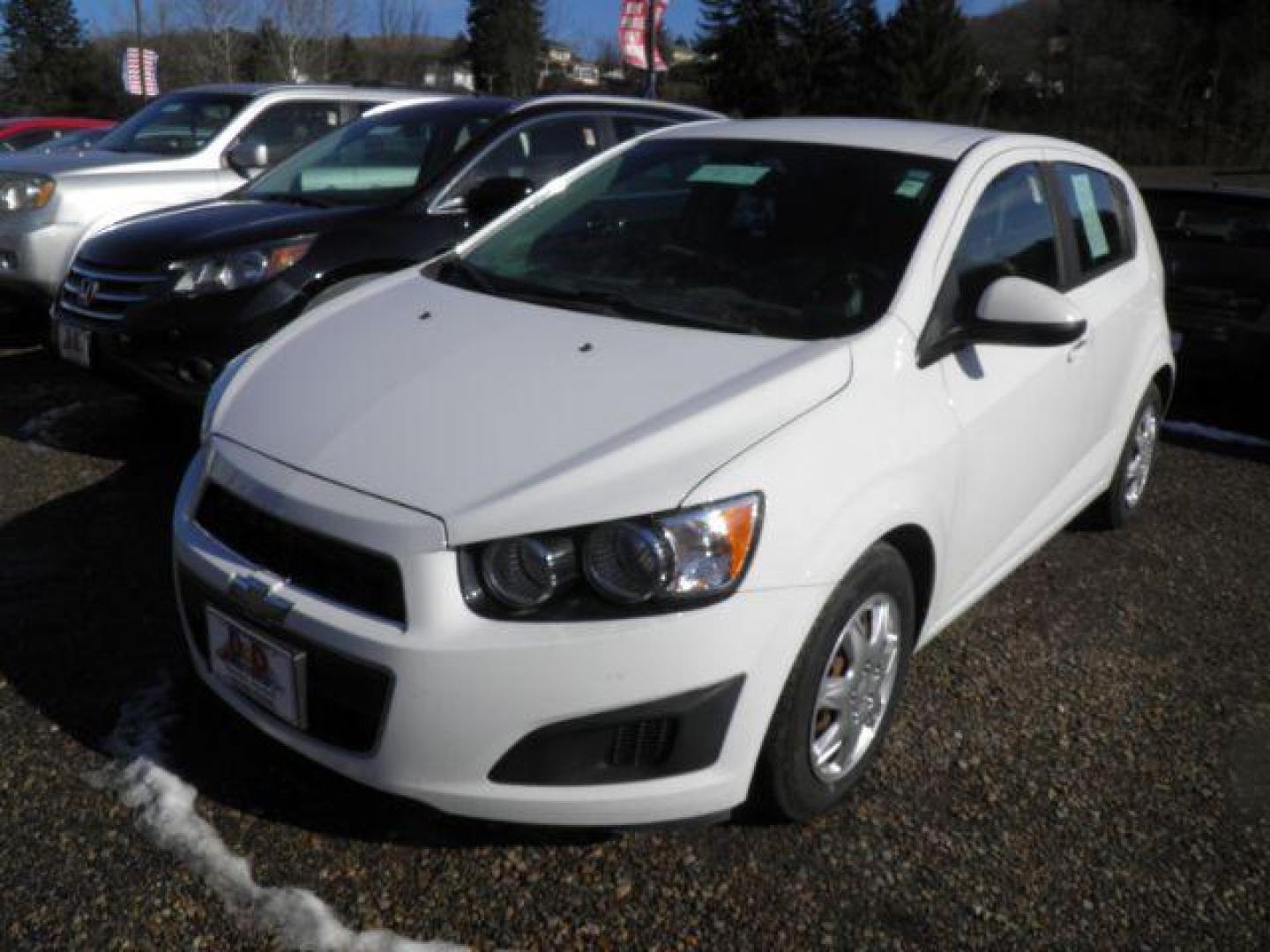2014 Summit White Chevrolet Sonic LS Auto 5-Door (1G1JA6SG9E4) with an 1.8L L4 DOHC 24V engine, 6-Speed Automatic transmission, located at 19521 New George's Creek Rd SW, Barton, MD, 21521, (301) 463-2404, 39.524323, -79.017906 - Photo#0