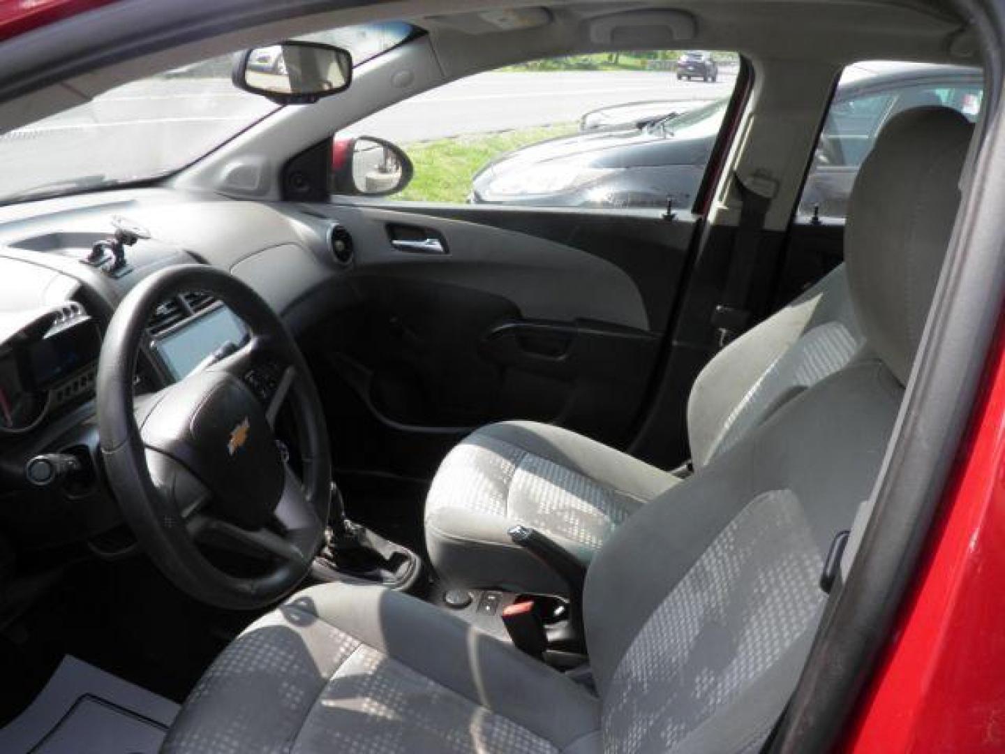 2014 Red Chevrolet Sonic LS Manual Sedan (1G1JB5SH5E4) with an 1.8L I4 engine, MAN transmission, located at 19521 New George's Creek Rd SW, Barton, MD, 21521, (301) 463-2404, 39.524323, -79.017906 - Photo#1