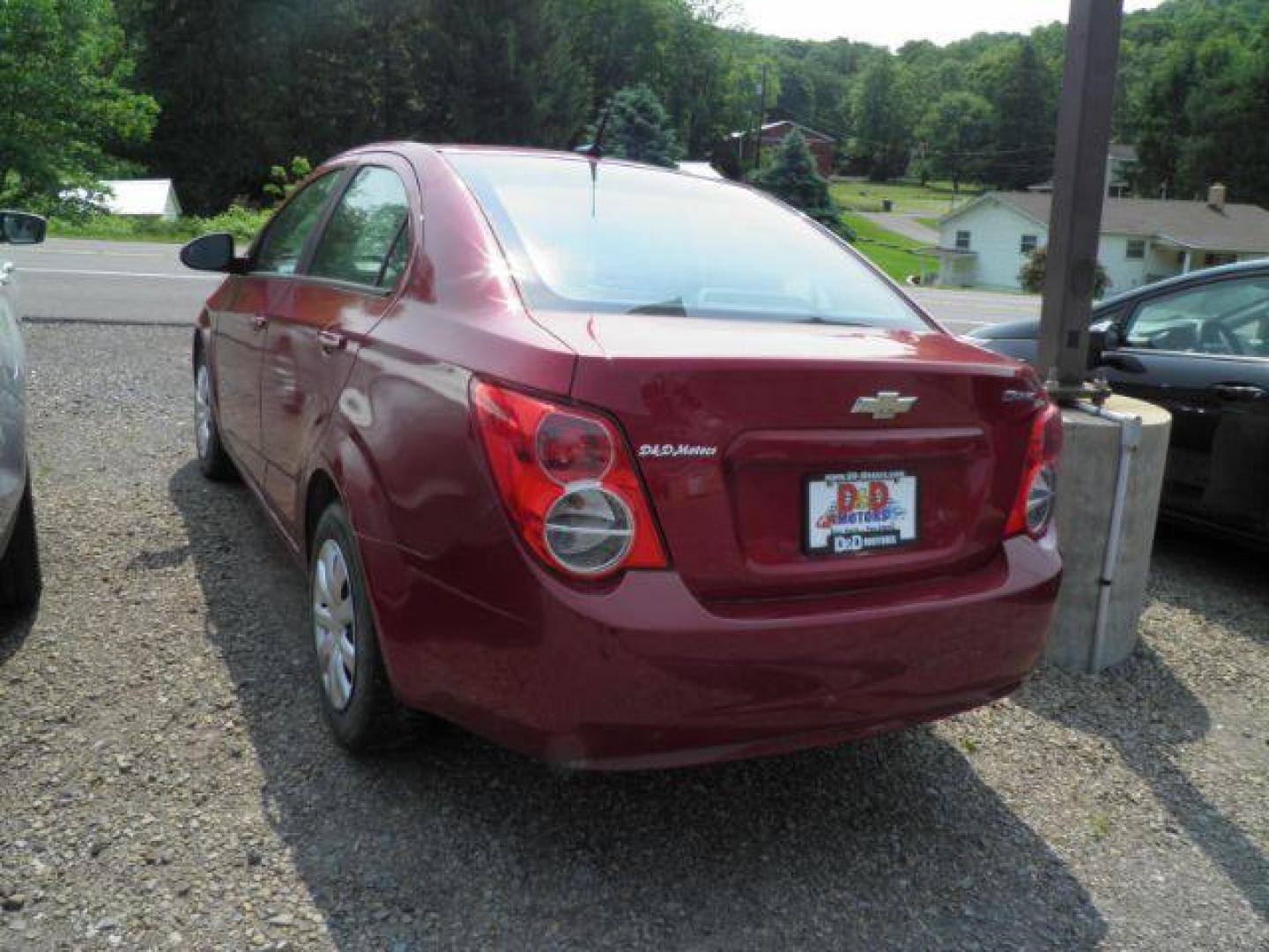 2014 Red Chevrolet Sonic LS Manual Sedan (1G1JB5SH5E4) with an 1.8L I4 engine, MAN transmission, located at 19521 New George's Creek Rd SW, Barton, MD, 21521, (301) 463-2404, 39.524323, -79.017906 - Photo#4