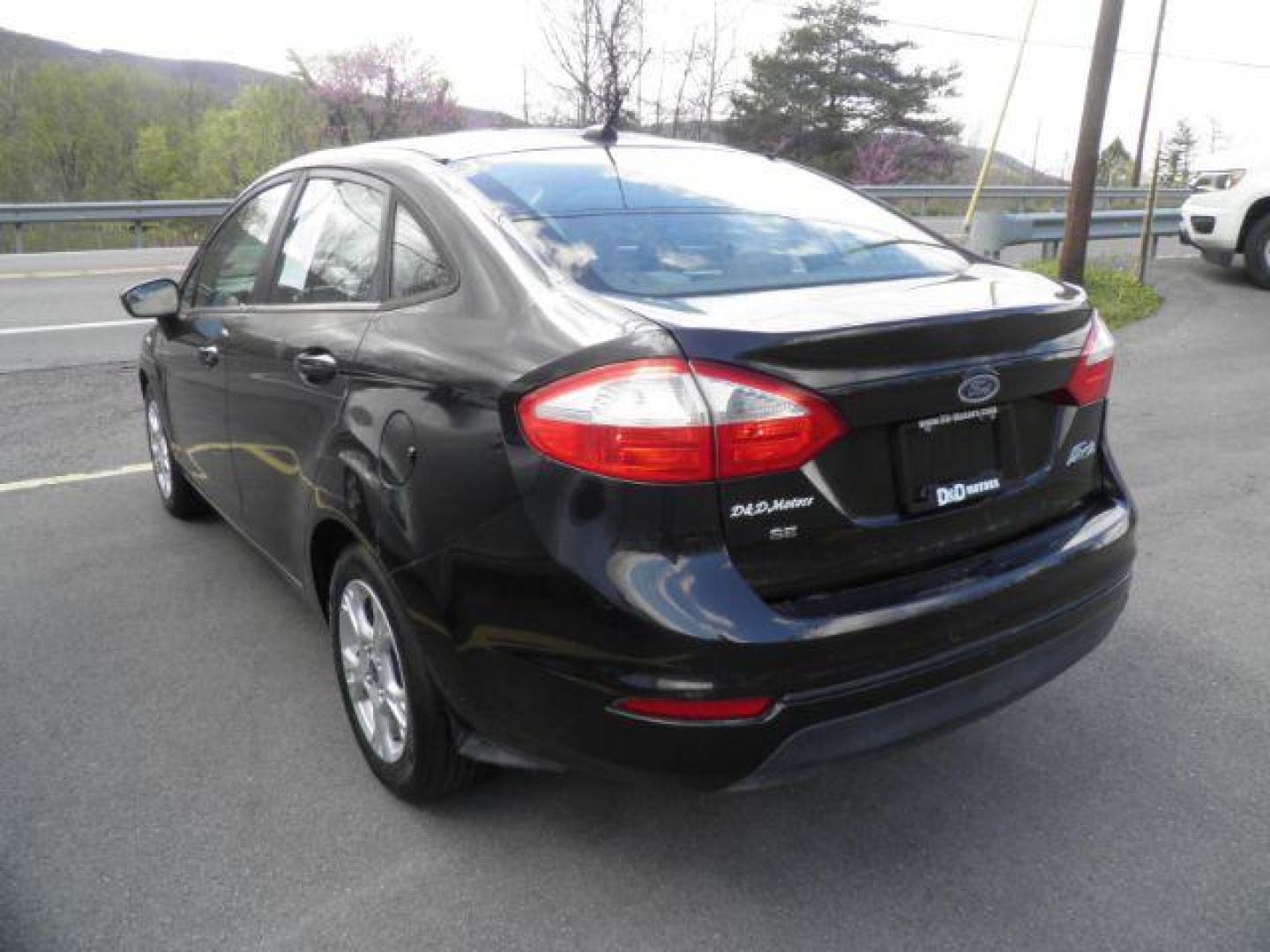 2014 Black Ford Fiesta SE Sedan (3FADP4BJ1EM) with an 1.6L I4 engine, AT transmission, located at 19521 New George's Creek Rd SW, Barton, MD, 21521, (301) 463-2404, 39.524323, -79.017906 - Photo#4