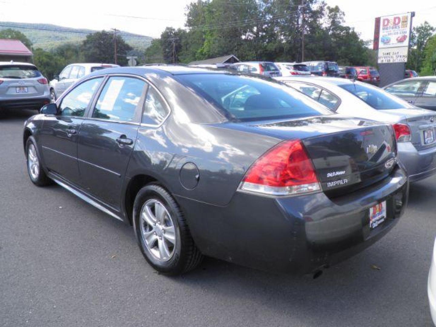 2015 Gray Chevrolet Impala Limited LS (2G1WA5E38F1) with an 3.6L V6 engine, AT transmission, located at 19521 New George's Creek Rd SW, Barton, MD, 21521, (301) 463-2404, 39.524323, -79.017906 - Photo#4