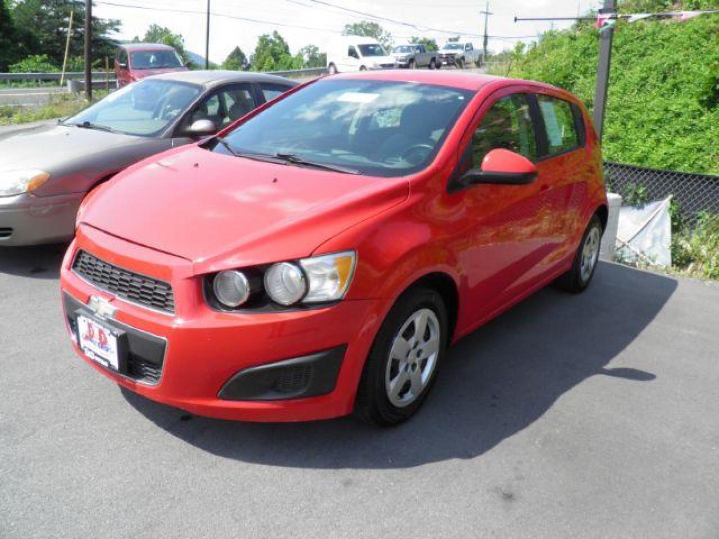 2015 Red Chevrolet Sonic LS Auto 5-Door (1G1JA6SG8F4) with an 1.8L I4 engine, AT transmission, located at 19521 New George's Creek Rd SW, Barton, MD, 21521, (301) 463-2404, 39.524323, -79.017906 - Photo#0