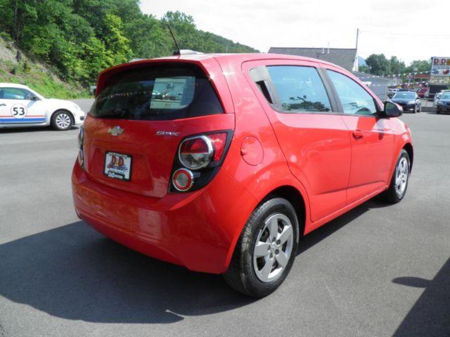 2015 Red Chevrolet Sonic LS Auto 5-Door (1G1JA6SG8F4) with an 1.8L I4 engine, AT transmission, located at 19521 New George's Creek Rd SW, Barton, MD, 21521, (301) 463-2404, 39.524323, -79.017906 - Photo#4