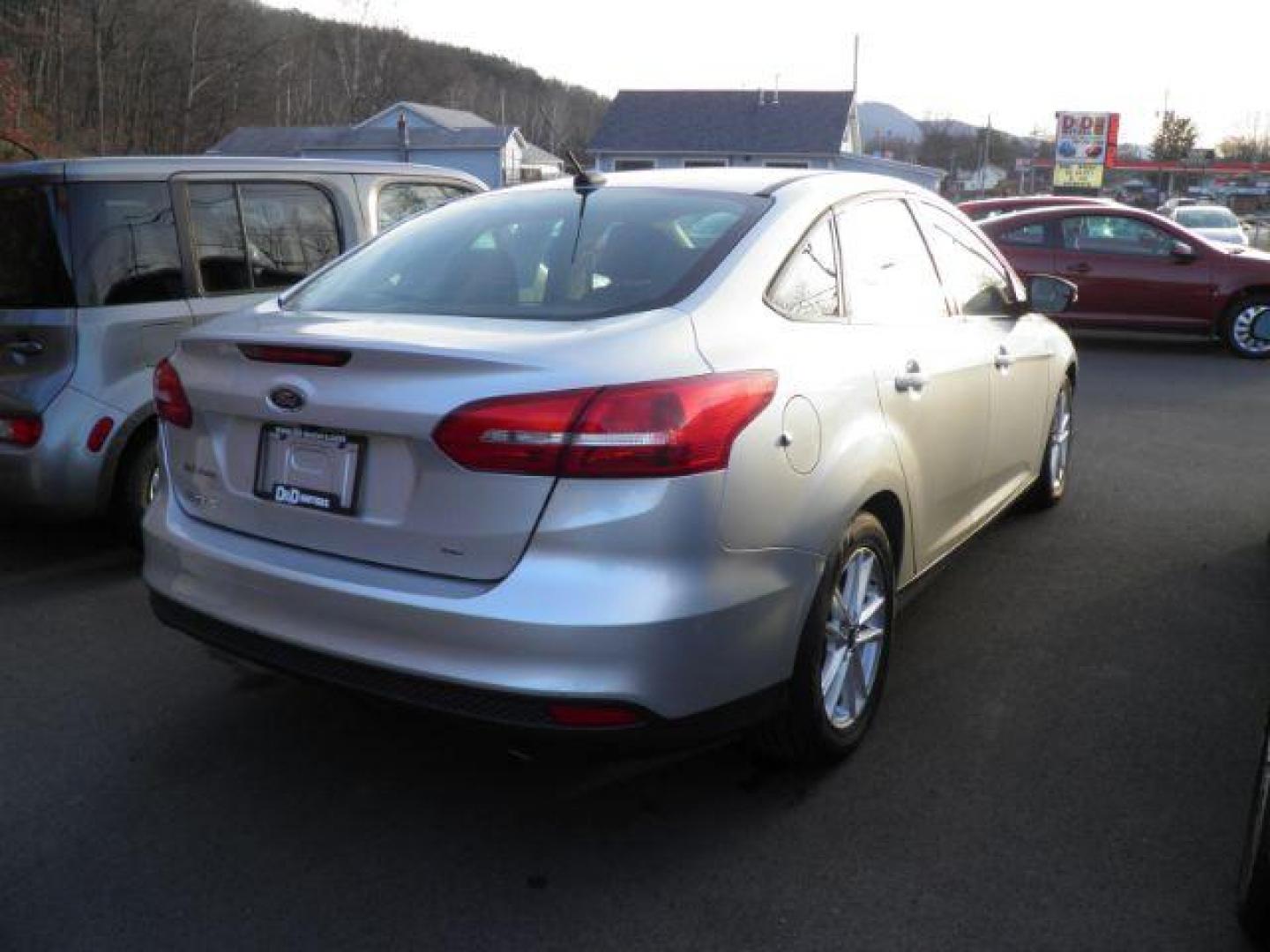 2016 Silver Ford Focus SE Sedan (1FADP3F24GL) with an 2.0L I4 engine, AT transmission, located at 15520 McMullen Hwy SW, Belair, MD, 21502, (301) 729-3700, 39.581375, -78.846451 - Photo#3