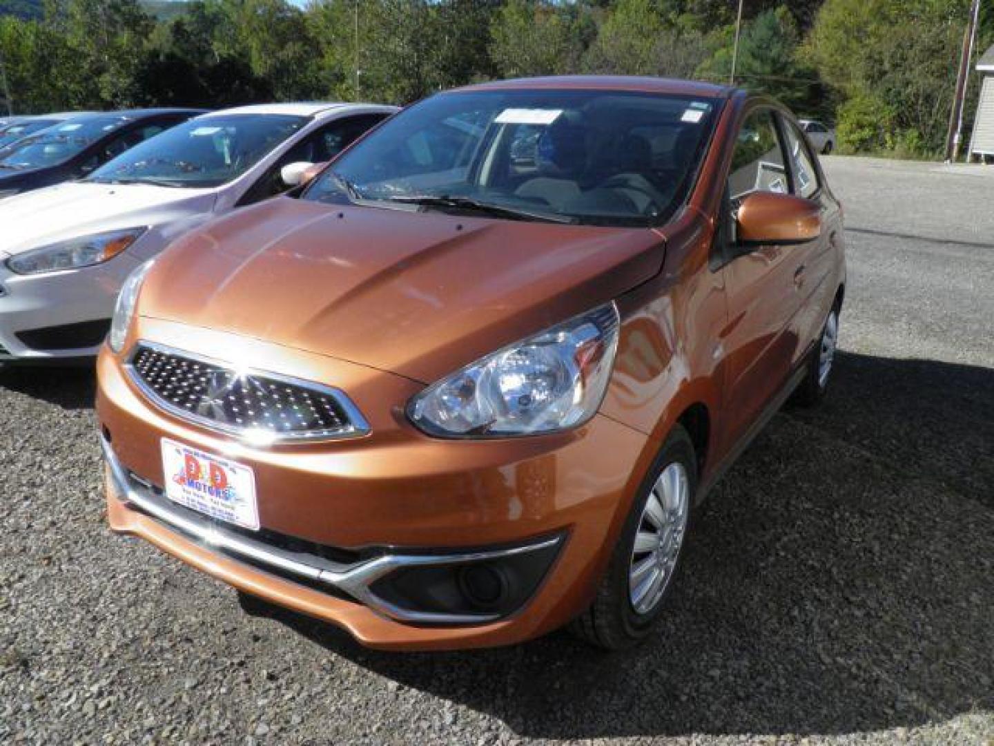 2019 Orange Mitsubishi Mirage ES 5M (ML32A3HJ6KH) with an 1.2L I3 engine, AT transmission, located at 19521 New George's Creek Rd SW, Barton, MD, 21521, (301) 463-2404, 39.524323, -79.017906 - Photo#0