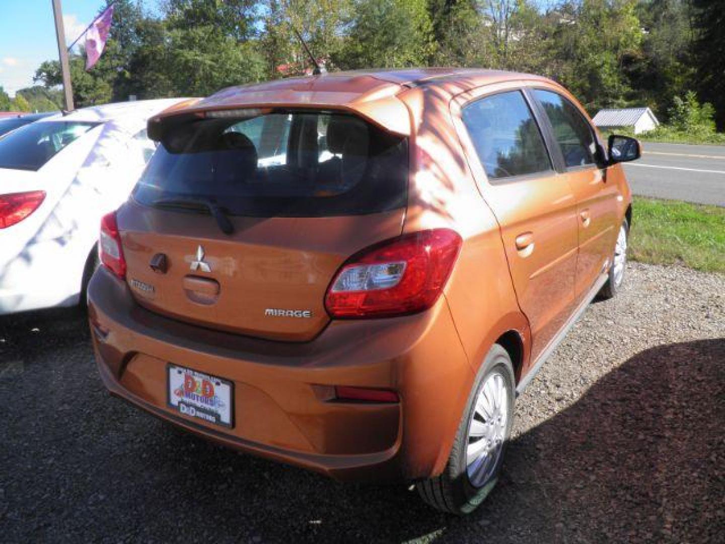 2019 Orange Mitsubishi Mirage ES 5M (ML32A3HJ6KH) with an 1.2L I3 engine, AT transmission, located at 19521 New George's Creek Rd SW, Barton, MD, 21521, (301) 463-2404, 39.524323, -79.017906 - Photo#5