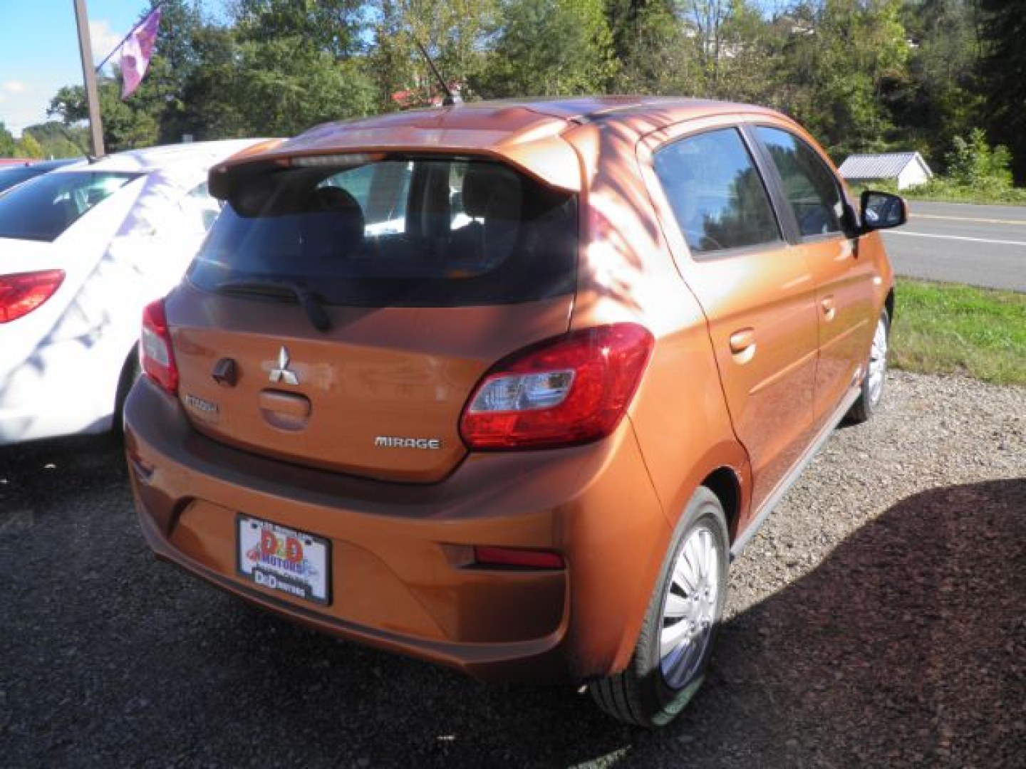 2019 Orange Mitsubishi Mirage ES 5M (ML32A3HJ6KH) with an 1.2L I3 engine, AT transmission, located at 19521 New George's Creek Rd SW, Barton, MD, 21521, (301) 463-2404, 39.524323, -79.017906- Photo#5